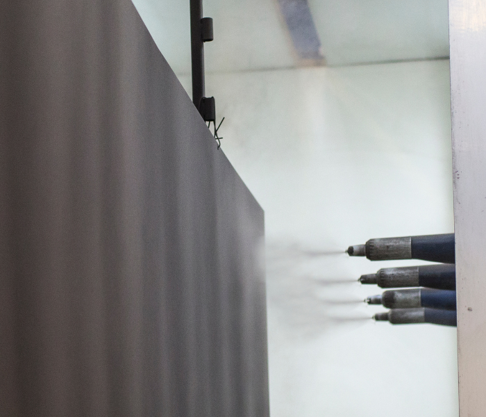 Aluminium panel being powder coated.